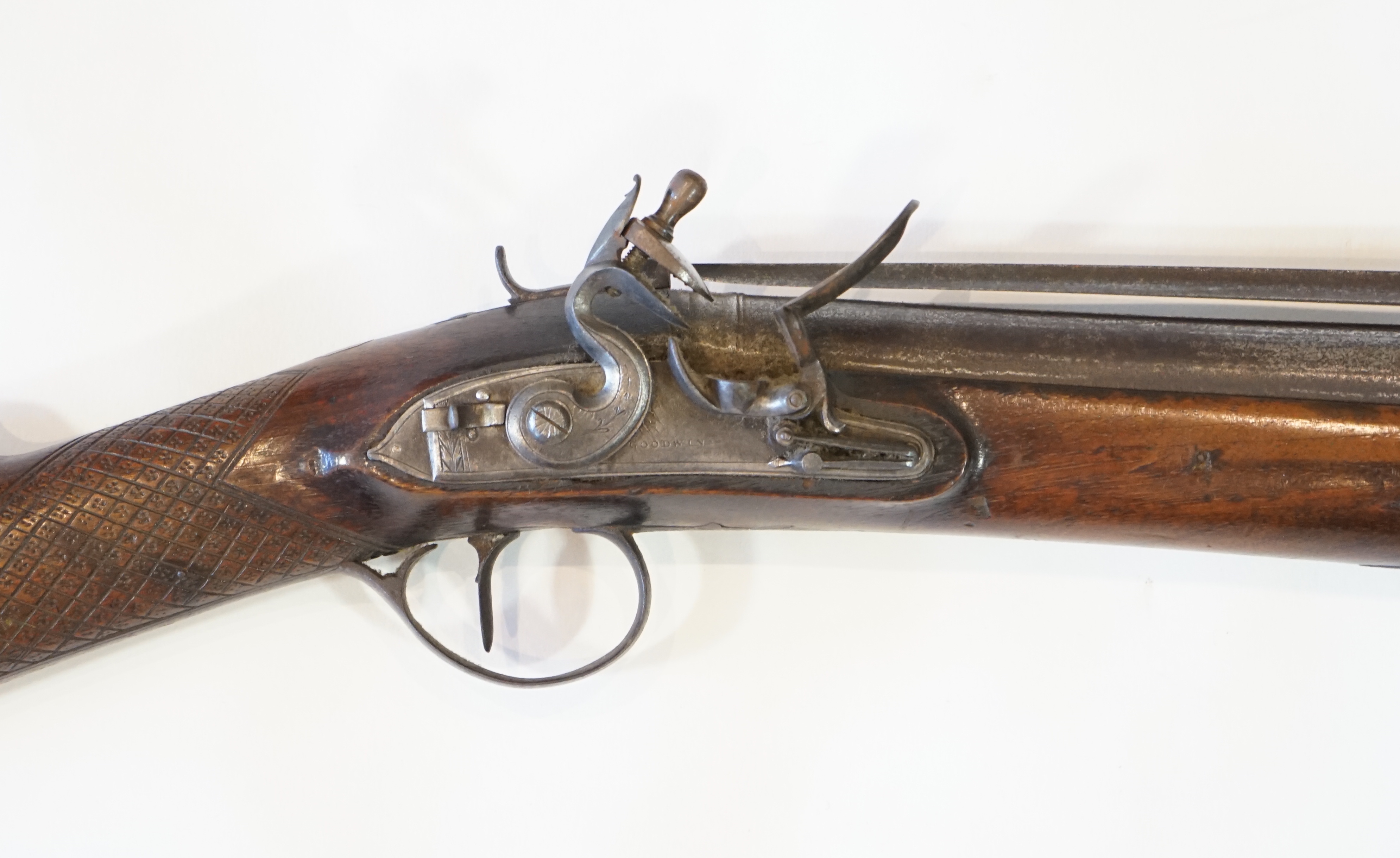 An iron barrelled flintlock blunderbuss by Goodwin of London, fitted with a top spring bayonet